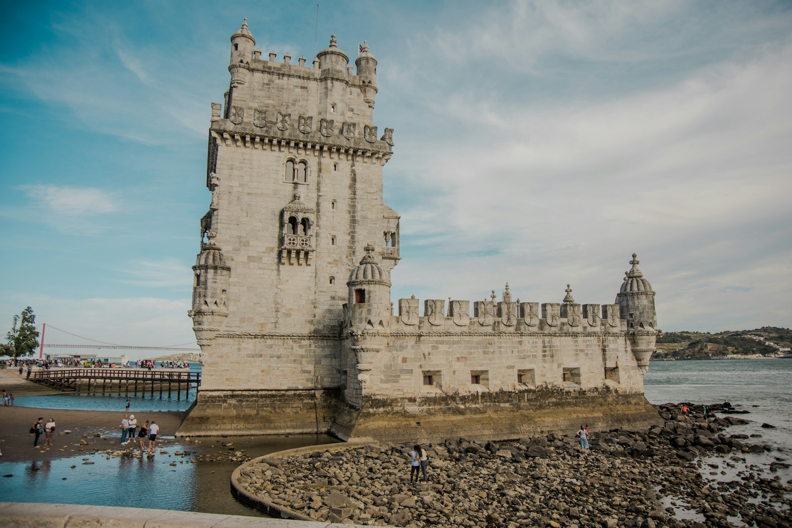 Photo by Tânia Mousinho concrete building near sea under blue sky during daytime